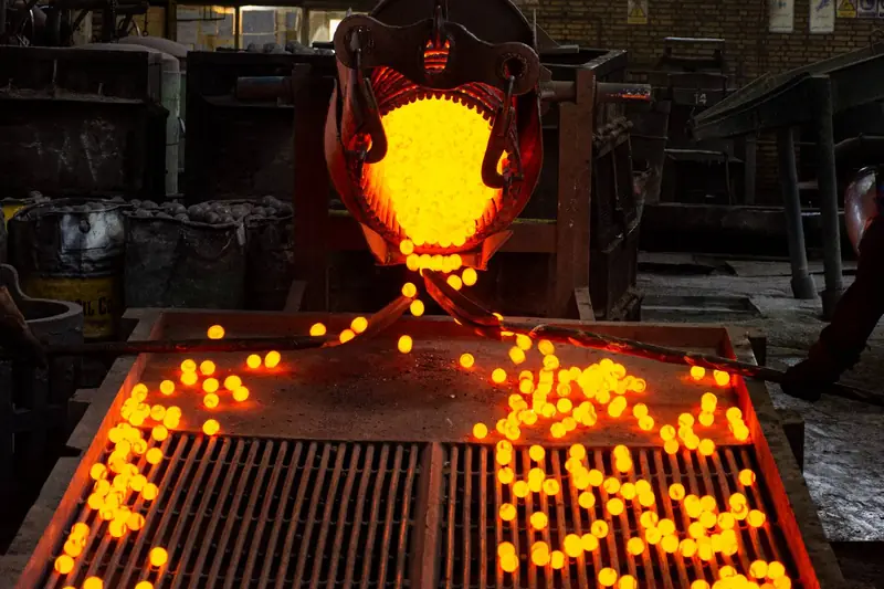 Red-hot grinding balls discharged onto the cooling grate