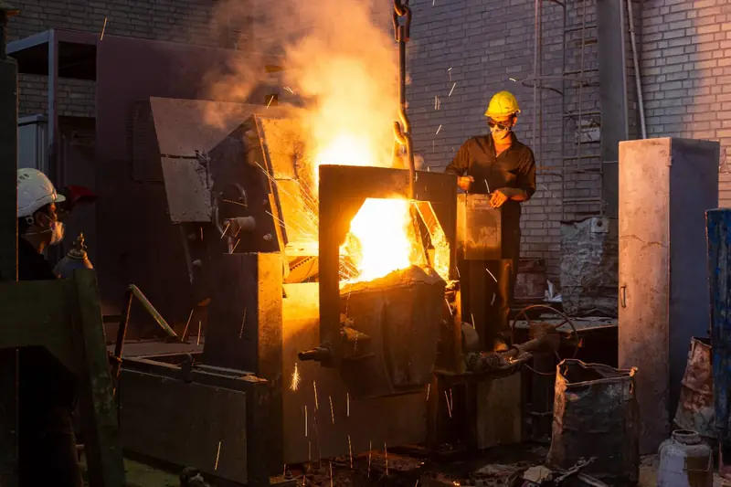 Induction furnace melting with operators