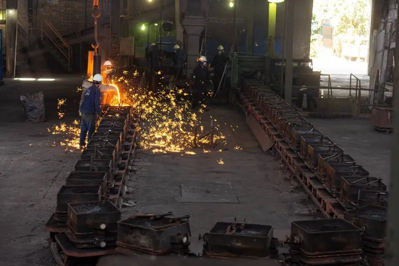 Pouring line — sparks over the mold row